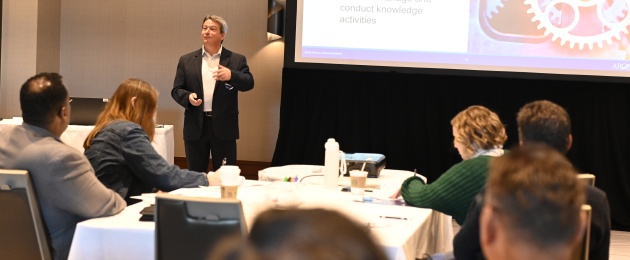A picture of Jeff Varney of APQC teaching a training course at the APQC Conference.