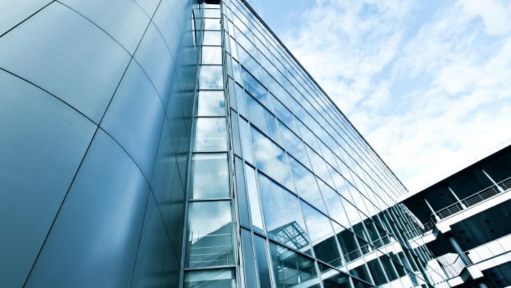 Photo of an office building from ground looking up