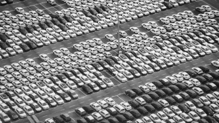 a lot of cars lined up in parking lot