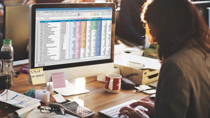 Person entering data on computer
