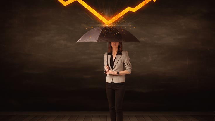 A lady holding an umbrella blocking a lightning bolt
