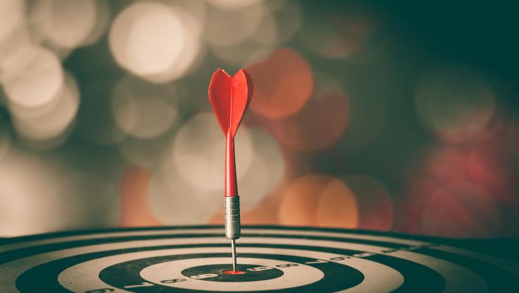 Picture of a dart hitting a bulls eye