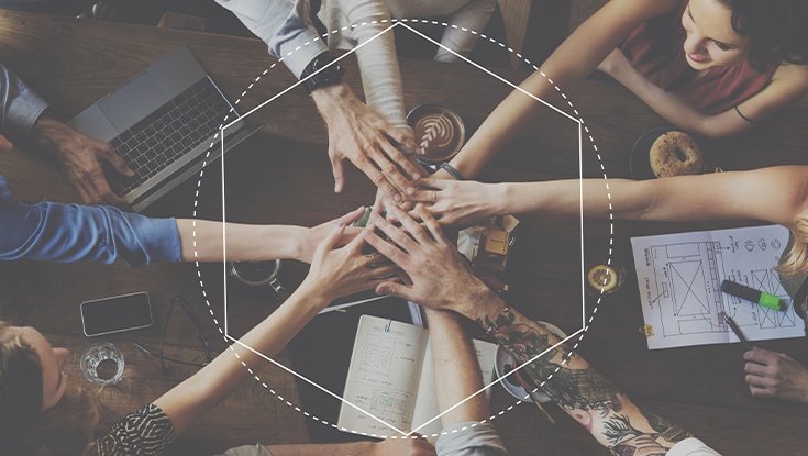 hands together displaying team work on a project