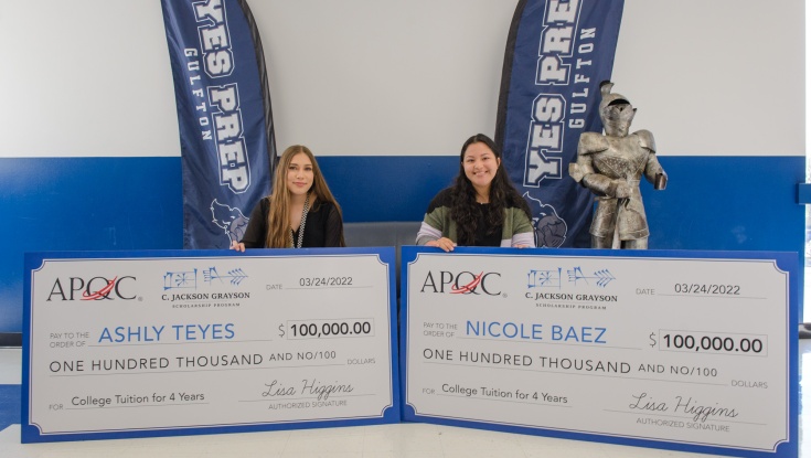 Photo of Ashly Teyes and Nicole Baez both holding their $100,000 checks