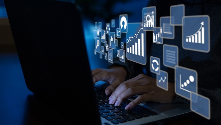 image of person seeing a lot of data coming from laptop
