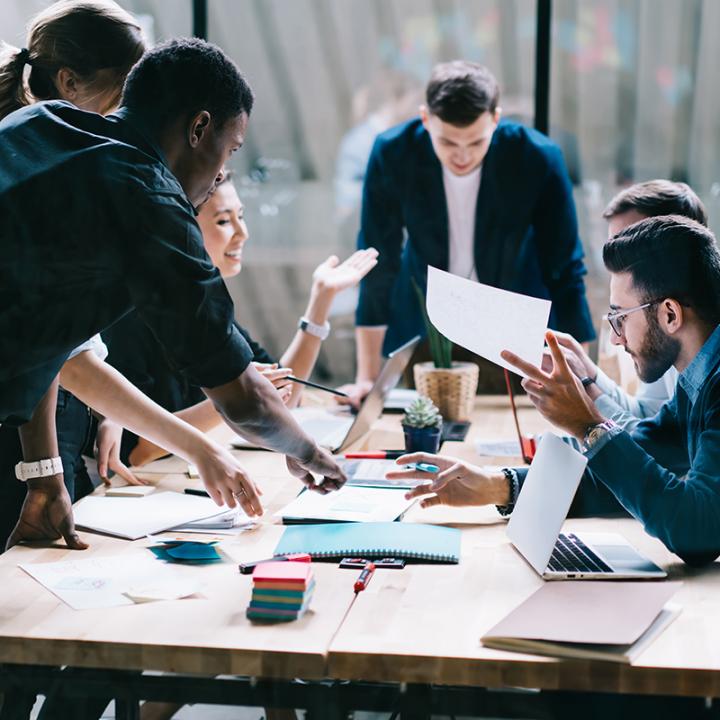 A group of folks working around a conference table