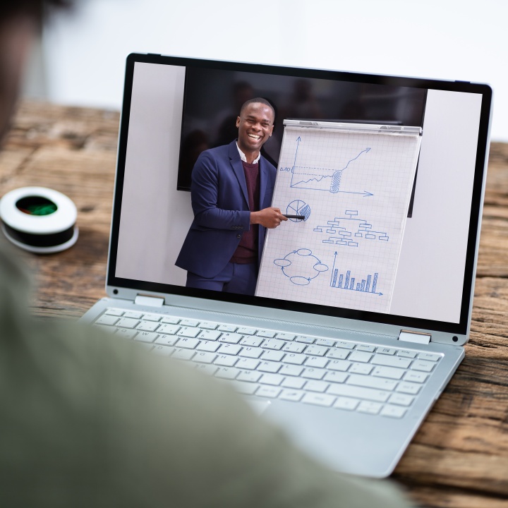 A man training employees virtually