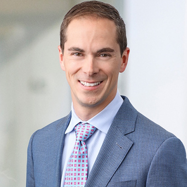 A picture of a male named Jeff Potter in a blue suit and tie with a light background. 