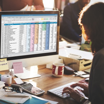 Person entering data on computer