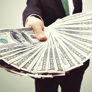 Image of man holding Money, Will Money on Learning and Development be worth it?