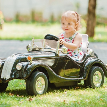 graphic, child driving car and text How to Drive Continuous Improvement 