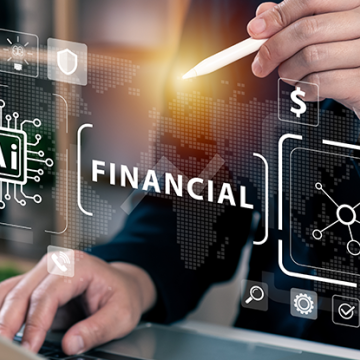 man typing on computer working on finance AI 