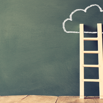 a ladder heading into the clouds, climbing the organizational maturity ladder correctly. 