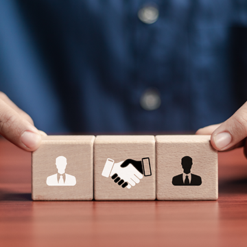 What partnerships are necessary to ensure a successful KM strategy?